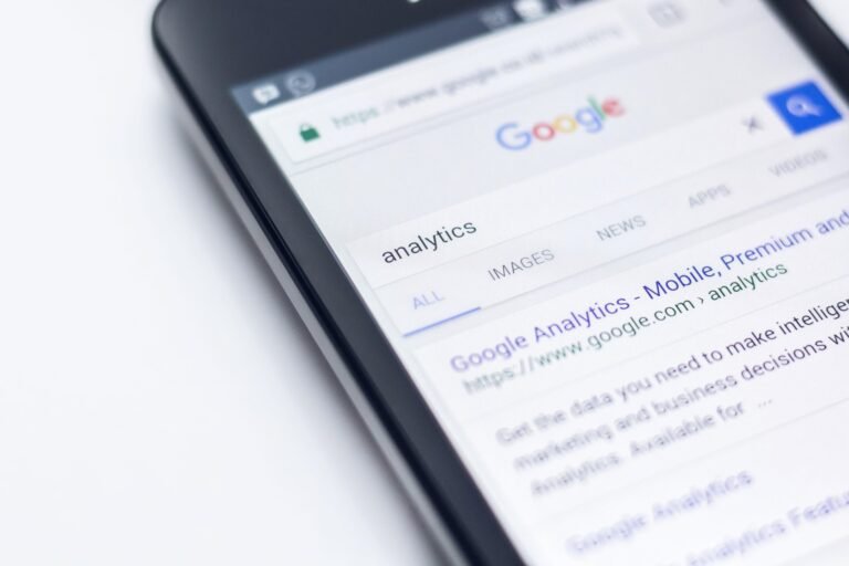 Mobile device displaying a Google search for the term "analytics."
