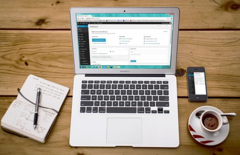 Laptop mockup displaying the WordPress website dashboard and content management interface.